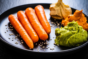Carrots with hummus and guacamole
