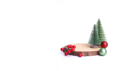 Merry Christmas mock up setups on white background. Xmas tree, jingle bells, wooden slice disc.