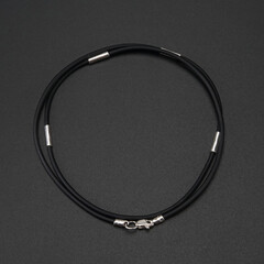 Isolated leather bracelet on black background. Lifestyle and men bracelets