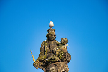 Fototapeta na wymiar Statue of the Madonna attending to St. Bernard on Charles bridge, Prague. Czech Republic.