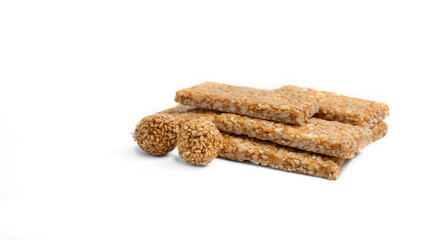 happy makar sankranti Til chikki and Till ke laddu sesame seed ball on white background