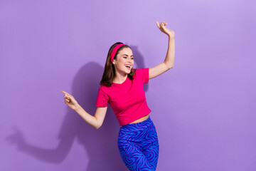 Naklejka premium Photo of carefree positive pretty girl have fun dancing chilling free time isolated on violet color background