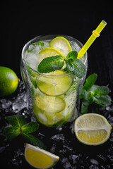 Refreshing summer alcoholic cocktail mojito with ice, fresh mint and lime. Copy Space
