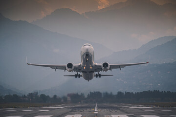 passenger plane takes off front view against