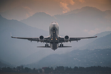 passenger plane takes off front view against