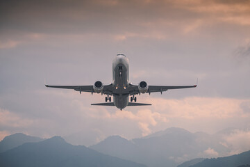 passenger plane takes off front view against