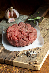 raw minced meat on dark wood