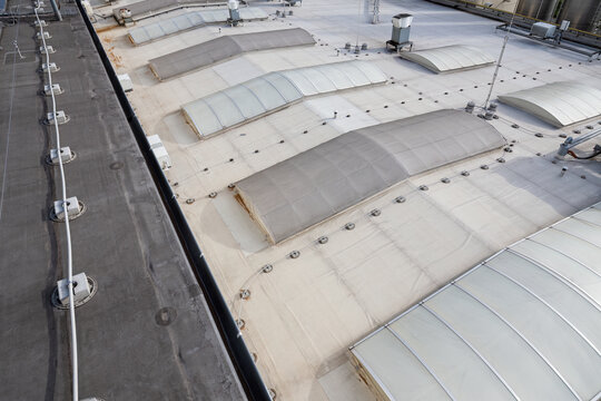 Footings holding the insulated lightning conductor and skylight on the roof of the hall.