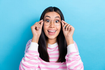 Photo of funny excited lady wear striped sweater arms spectacles open mouth isolated blue color background