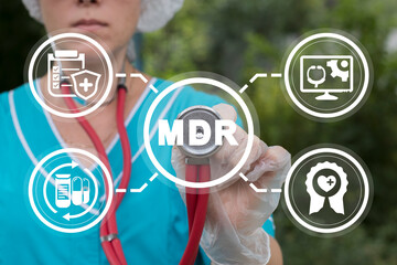 Doctor or nurse using virtual touchscreen and stethoscope touches abbreviation: MDR. Concept of MDR...