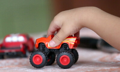 Children toy red car in the child's hand © fad82