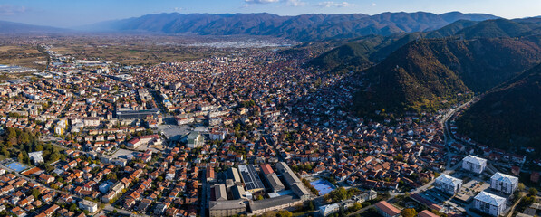 Aerial view of the city Strumica in North Macedonia on a sunny day in autumn. - obrazy, fototapety, plakaty