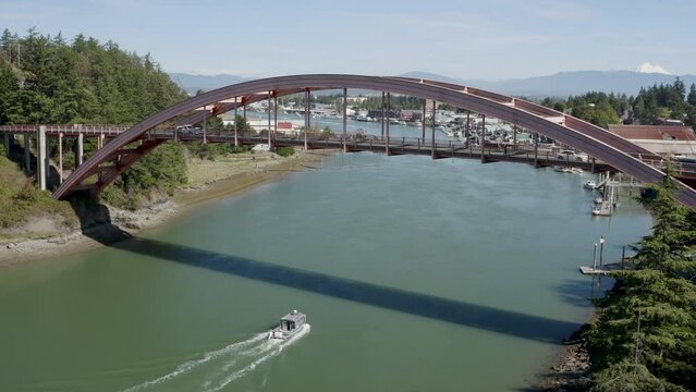 Fishing Boat Circumnavigating Swinomish Channel in La Conner Washington USA - City Establishing Shot Aerial Overhead Landscape View
