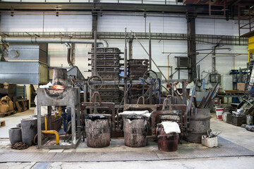 Stacked jigs and tools in a small foundry