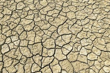 Dry and cracked land, dry due to lack of rain, in the . Effects of climate change such as desertification and droughts.