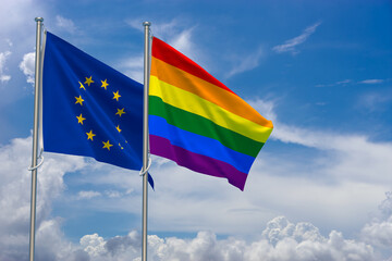 Gay Pride Flag and European Union Flag over Blue Sky Background. 3D Illustration