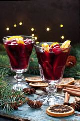 Mulled wine with slice of orange and spices