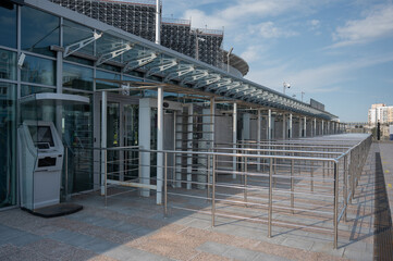 Turnstiles in front of the entrance to the stadium. 
