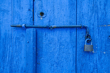 Old historical colorful doors and shutters made of wrought iron and wood. Old historical wooden doors in Cyprus. Doors and shutters of historical stone houses in Nicosia.