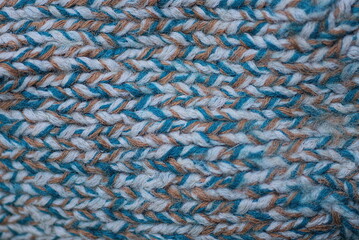 colored texture of woolen knitted fabric on clothes