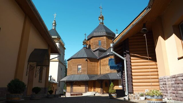 Manyava Skete of Exaltation of Holy Cross in forest in Carpathian mountains, Ukraine. Orthodox solitary cell mens monastery, skete. Near skete in wood there is Blessed Stone, object of worship