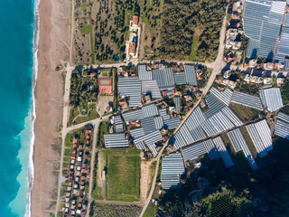 Aerial view of modern agriculture of today. Full of greenhouses everywhere. Concept for human...