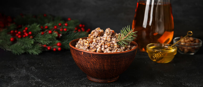 Bowl of Ukrainian Christmas kutya dish on dark background