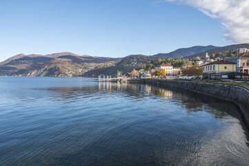 Fototapeta na wymiar Extra wide angle view of The promenade on the lake in Luino with the mountains in the background