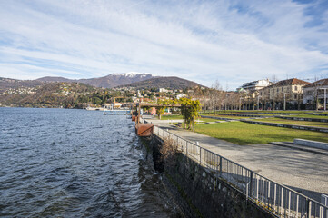 The beautiful Parco a Lago in Luino with the snow-capped mountains in the background