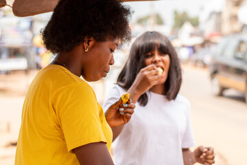woman is eating roasted plantain
