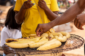 people buying roasted plantain