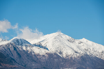 Fototapeta na wymiar Monte Limidario on Lake Maggiore with its snowy peak