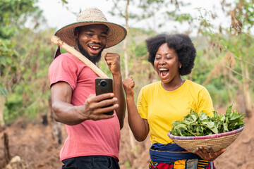 african farmers checking a phone together
