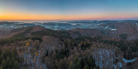 Panoramic view on the Odenwald near Lampenhain and fog over the Rhine Valley in Germany.