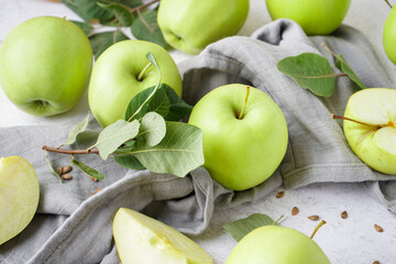 Fresh green apples on light table, closeup