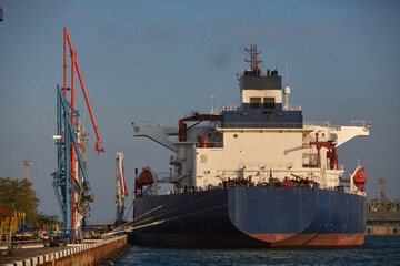 Oil tanker at the port terminal. Tanker in port at oil terminal
