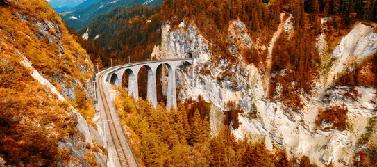 Papier Peint photo Viaduc de Landwasser Landwasser Viaduct in autumn, Switzerland. Panoramic view of railway in mountain