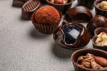 Chocolate candies on grunge background, closeup