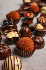 Chocolate candies on grunge background, closeup