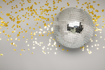 Disco ball with confetti on grey background