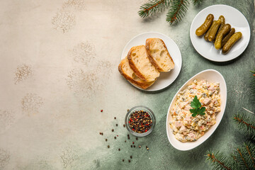 Bowl of Olivier salad, bread and pickles on grunge background