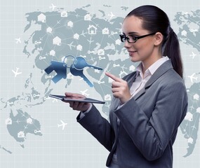 Businesswoman with tablet in hotel booking concept