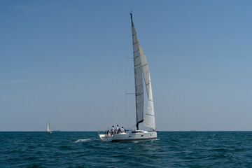 Sailing. Yacht ship with white sails in open sea. Luxury boats.. Yachting. Luxury Yachts.