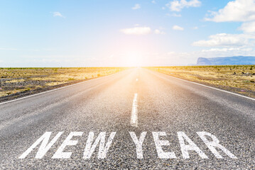 New Year ahead. Conceptual image of a straight road to horizon with the phrase 