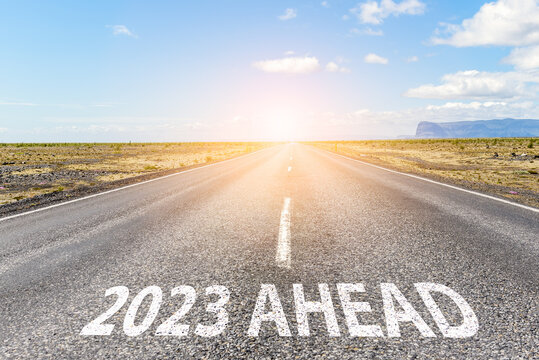 New Year 2023 Ahead. Conceptual Empty Straight Road In A Flat Landscape With The Phrase 