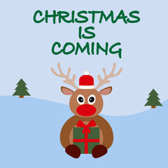 Christmas is coming post card with fanny reindeer in santa hat and big red nose holding green gift box with red ribbon and bow. pine trees on blue background
