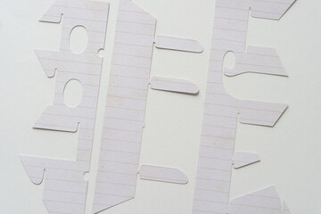 abstract background with cut paper stencils (alphabetical)