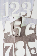 large numbers cut from old scrapbook paper