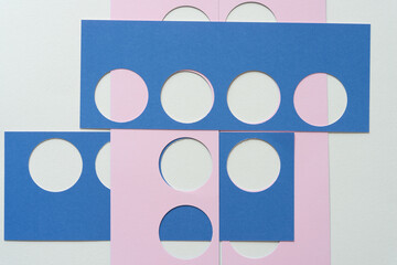 pink and blue stencils with circle shape cutouts