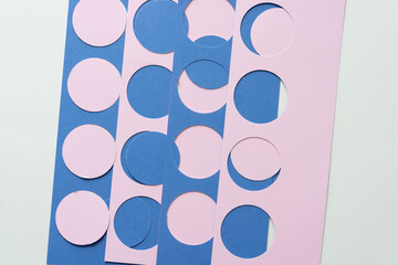 pink and blue stencils with circles and circle cutouts